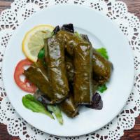 Grape Leaves · Veg. Grape leaves stuffed with seasoned rice, tomatoes, parsely, onions, topped with olive o...
