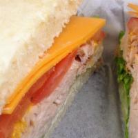 Turkey & Cheddar · Turkey, Cheddar, Lettuce, Tomatoes and Onions with Mayonnaise and Mustard.