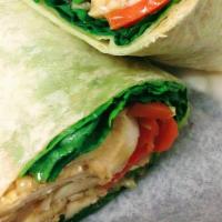 Peanut Chicken Wrap · Chicken Breast, Carrots, Cucumber, Lettuce, Tomatoes and Onions with Peanut Sauce.