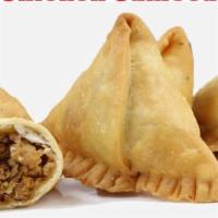 Lamb Samosa (2 Pieces) · Crisp pastry filled with lamb, mildly spiced onions and peas