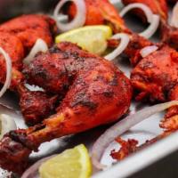 Tandoori Chicken (8 Pcs) · Chicken marinated in yogurt sauce and spices. Cooked in tandoor oven.