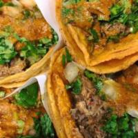 Taco Azteca · Reg size tortilla, nopal (cactus), frijoles de la hoya, and toppings.