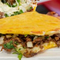 Mulita · Choice of meat, cheese, sandwiched between two corn tortillas, onion, and cilantro.