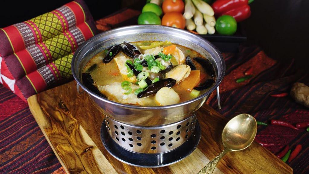 Seafood Soup (Hot Pot) · Lemongrass broth or rich coconut soup. A delicious blend of shrimp, scallops, calamari, fish, and mussels in choice of soup.