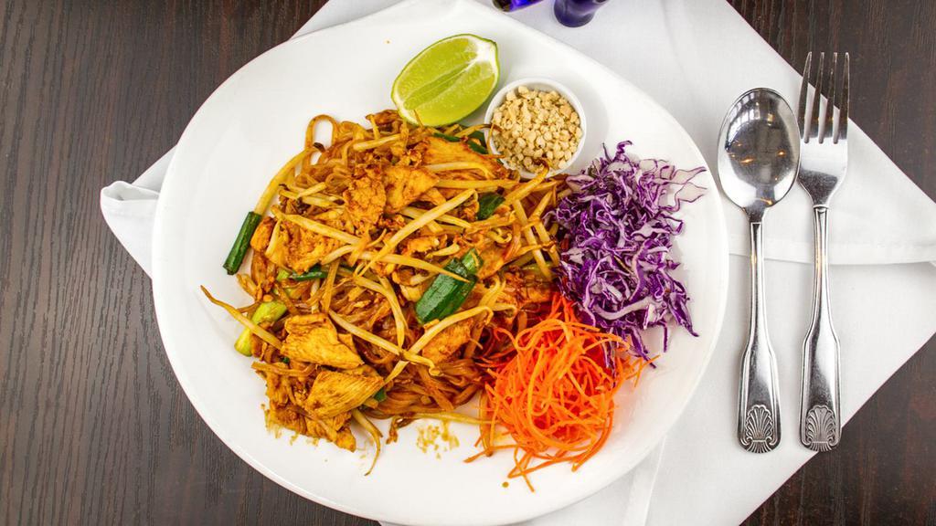 Pad Thai · The dish that made Thai food famous. Thin rice noodles stir-fried with bean sprouts, green onion, egg, tamarind sauce, and side of crushed peanuts.