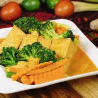 Golden Triangle · Golden fried tofu with seasoning, vegetables, and peanut curry sauce.