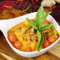 Roasted Duck With Red Curry · Boneless roasted duck topped with spicy red curry sauce, fresh basil, bell peppers, tomatoes...