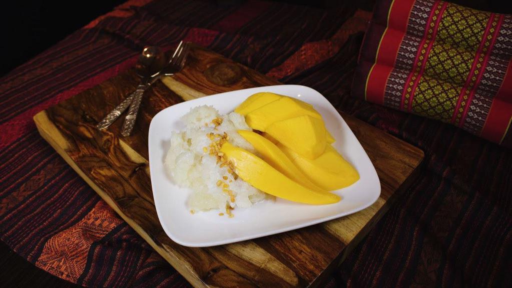 Sweet Sticky Rice With Mango · Thai sticky rice cooked with coconut milk and sugar, served along side with ripe sweet mango.
