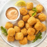 Thoughts For Tots · (Vegetarian) Shredded Idaho potatoes formed into tots, battered, and fried until golden brown.
