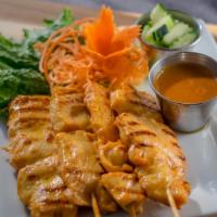 Chicken Satay (Chicken Skewers) · Thai style marinated grilled chicken breast on skewers served with peanut sauce and cucumber...