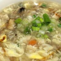 Egg Drop Soup · Eggs, peas, carrots, mushrooms and steamed tofu in mild chicken broth.