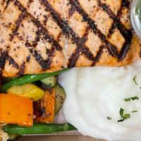 Grilled Salmon · Grilled Salmon over sauteed kale, roast vegetables, whipped potatoes,  Comes with a side of ...