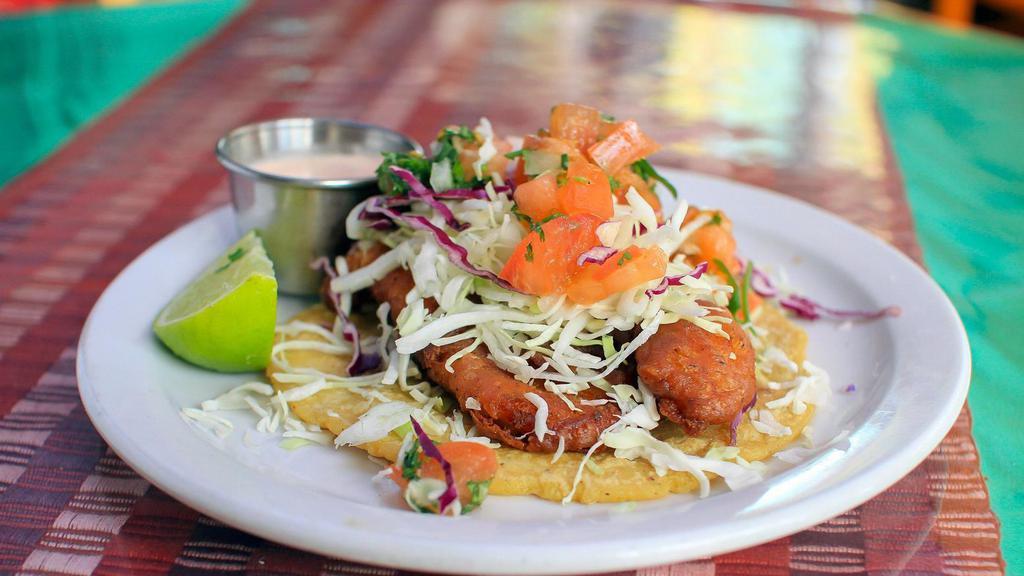 Baja Fish Taco · Topped with cabbage and pico de gallo and served on a fresh pressed corn tortilla with a side of chipotle crema.