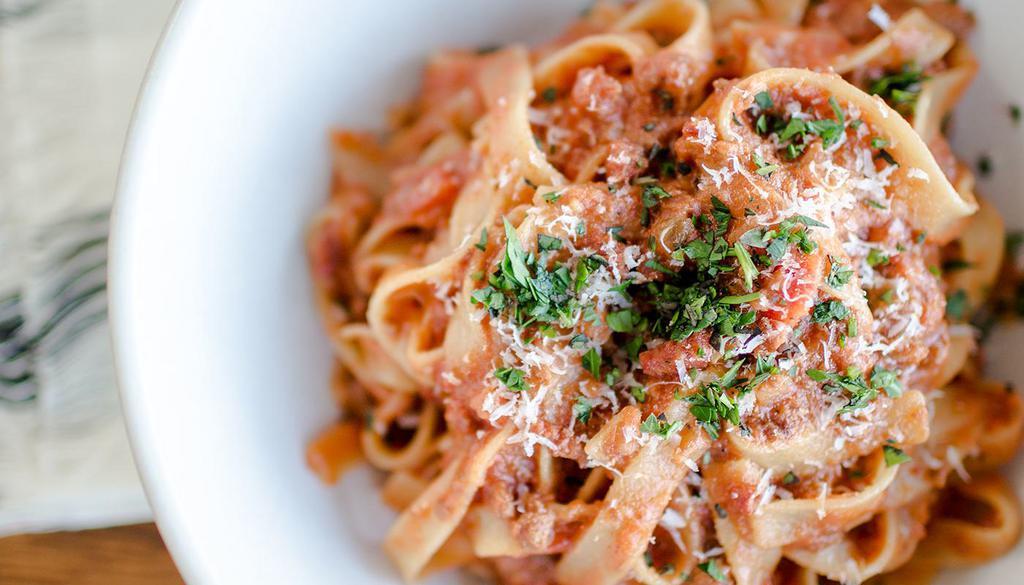 Bolognese · House specialty. Traditional meat sauce, tagliatelle noodle and grana padano cheese.