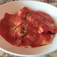 Ravioli Della Nonna · Vegetarian. Homemade ravioli, filled with spinach and ricotta, onions flamed in vodka with m...