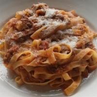 Fettuccine Bolognese · All Rights Reserved. 

Flat noodles with ragu beef sauce.