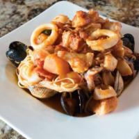 Capellini Pescatore · Angel hair pasta with shrimp, mussels, clams, calamari, mixed fresh fish in a mild spicy mar...