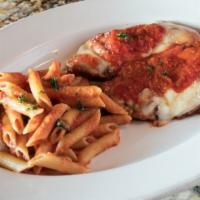 Pollo Parmigiano · Skinless-boneless chicken breast breaded and sautéed, topped with fontina cheese and marinar...
