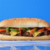 Grilled Pepper Cheesesteak · Philly cheesesteak loaded with grilled steak, melted cheese, and grilled bell peppers on a t...