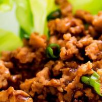 Chicken Lettuce Wraps · Chicken breast with water chestnuts, green onions, white onions served with lettuce and dipp...