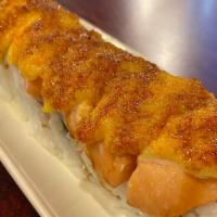 Baked Salmon Roll · California roll, cream cheese, gobo. On top - baked salmon with dynamite sauce.