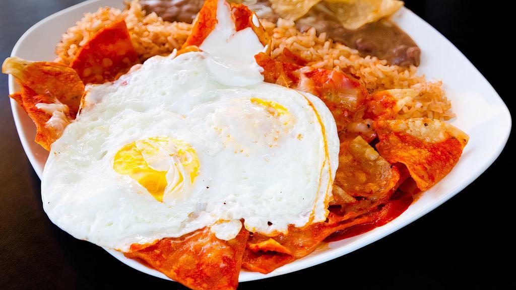 Chilaquiles With Eggs · Chilaquiles with your choice of sauce red or green and eggs, served with rice, beans.
