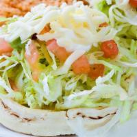 Sope · Served with your choice of meat, beans, lettuce, tomato, sour cream, guacamole, and cheese.