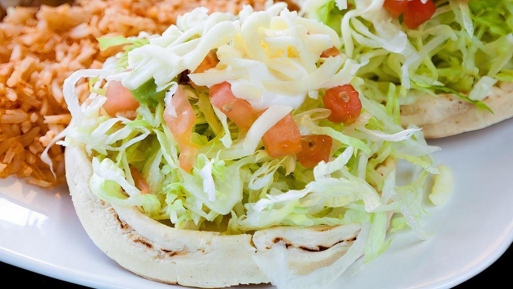 Sope · Served with your choice of meat, beans, lettuce, tomato, sour cream, guacamole, and cheese.
