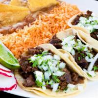 Taco Plate · Served with three tacos, rice and beans.
