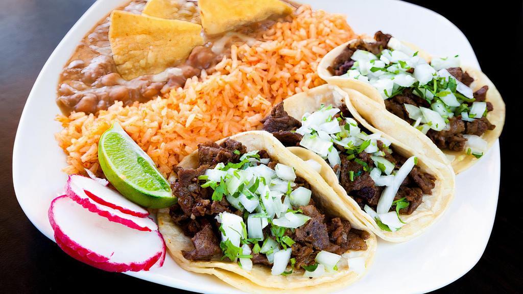 Taco Plate · Served with three tacos, rice and beans.