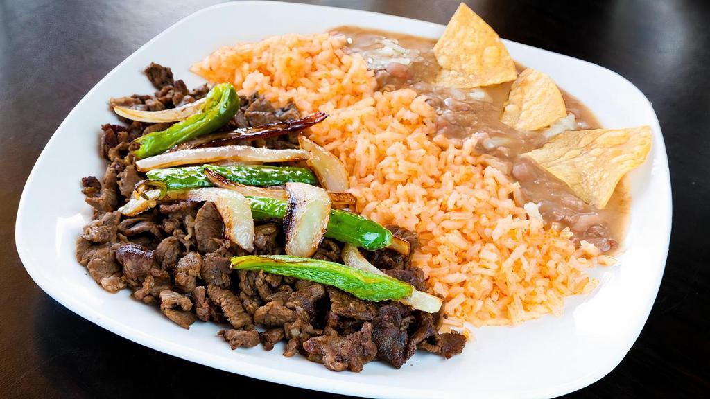 Asada Plate · Served with asada, grilled onions and jalapeño, rice, beans and 3 (corn) handmade tortillas.