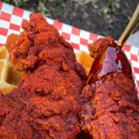Combo #2 Nashville Hot Chicken & Waffle · 2 golden crispy chicken tenders seasoned with your preferred heat level on a warm waffle, ma...