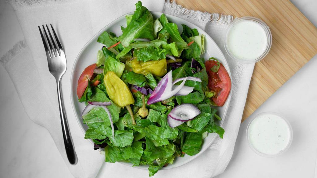 Garden Salad · Romaine lettuce, mixed greens, tomatoes, & red onion.