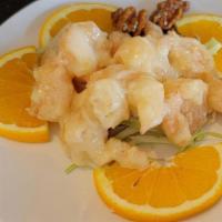 Walnut Shrimp · Fried shrimp marinated in our house mayo sauce serve with honey-glazed walnuts over fresh le...