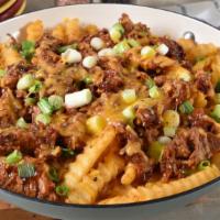Chile Colorado Nacho Fries · Beef along with guacamole, pico de gallo, sour cream, beans and cheese smothered ontop of cr...