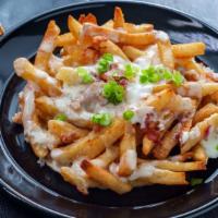 Chile Verde Nacho Fries · Pork along with guacamole, pico de gallo, sour cream, beans and cheese smothered ontop of cr...