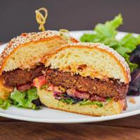 Comoncy Beyond Burger · Brioche bun, quinoa-crusted beyond meatless burger, organic tomato, crispy onion, remoulade,...