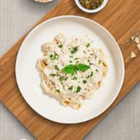 Far Far Fettuccine Alfredo  · Fresh fettuccine pasta cooked in alfredo sauce and topped with black pepper, parsley, and pa...