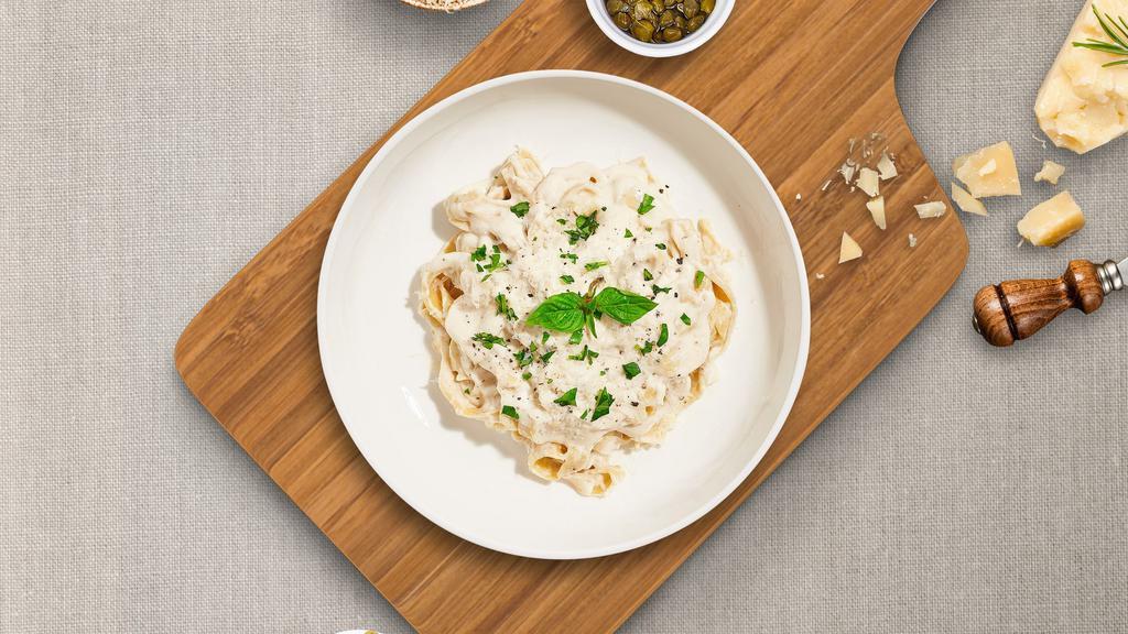 Far Far Fettuccine Alfredo  · Fresh fettuccine pasta cooked in alfredo sauce and topped with black pepper, parsley, and parmesan.