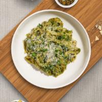 Fettuccine Manipesto · (Vegetarian) Fresh fettuccine pasta cooked in a pesto sauce and topped with black pepper, pa...