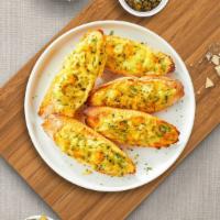 Garlic Manic Cheesy Bread · (Vegetarian) Housemade bread toasted and garnished with butter, garlic, mozzarella cheese, a...