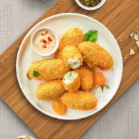 Jalapeno Poppers · (Vegetarian) Fresh jalapenos coated in cream cheese and fried until golden brown.