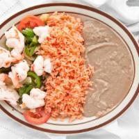 Shrimp Fajitas · Shrimp, onion, bell pepper, garden salad, two side orders, toast or tortillas.