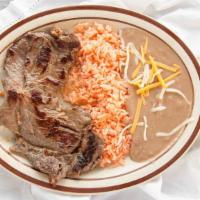 Beef Asada Plate · 8 oz grilled steak, two side orders, garden salad, toast or tortillas.