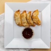 Gyoza · Pork dumplings served with a dipping sauce.