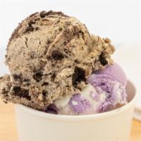 50/50 · A scoop of ice cream with a scoop of edible raw cookie dough on top.