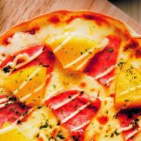 Hawaiian Pizza  · Personal sized pizza on tortilla baked to a crisp topped with red sauce, pineapple, ham & mo...