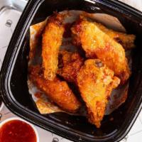 Chicken Wings 12 Pcs · Lightly breaded chicken wings with a choice of sweet crunchy chili sauce, buffalo and bbq sa...