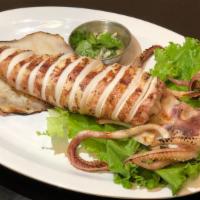 Grilled Jumbo Squid  · Fresh grilled jumbo squid served with house spicy seafood sauce.