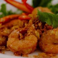 Garlic Shrimp · Deep fried marinated shrimp on shell with garlic and pepper served with chili sauce.